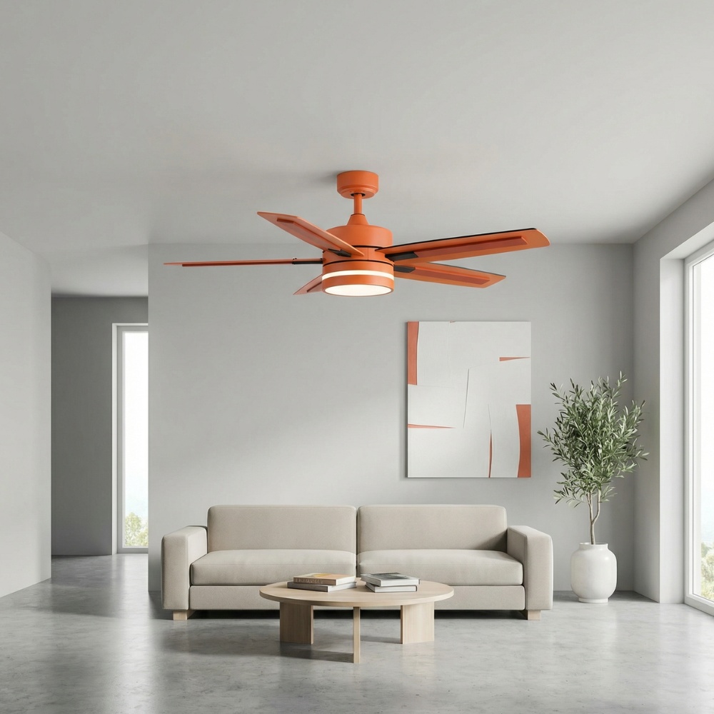 Modern living room featuring a stylish orange ceiling fan with integrated light, a beige sofa, a round coffee table with books, and a decorative plant next to a large window.